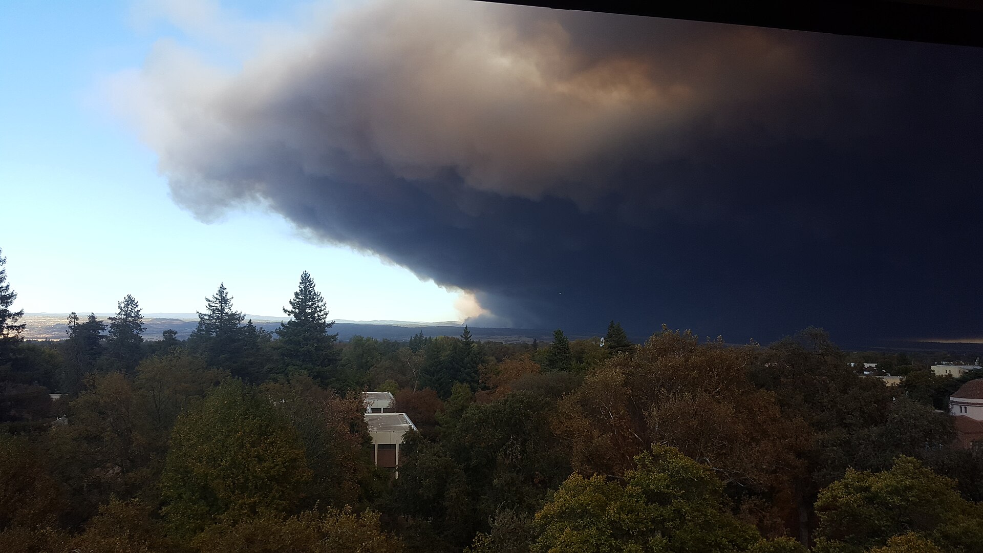 A massive smoke plume seen from many miles away