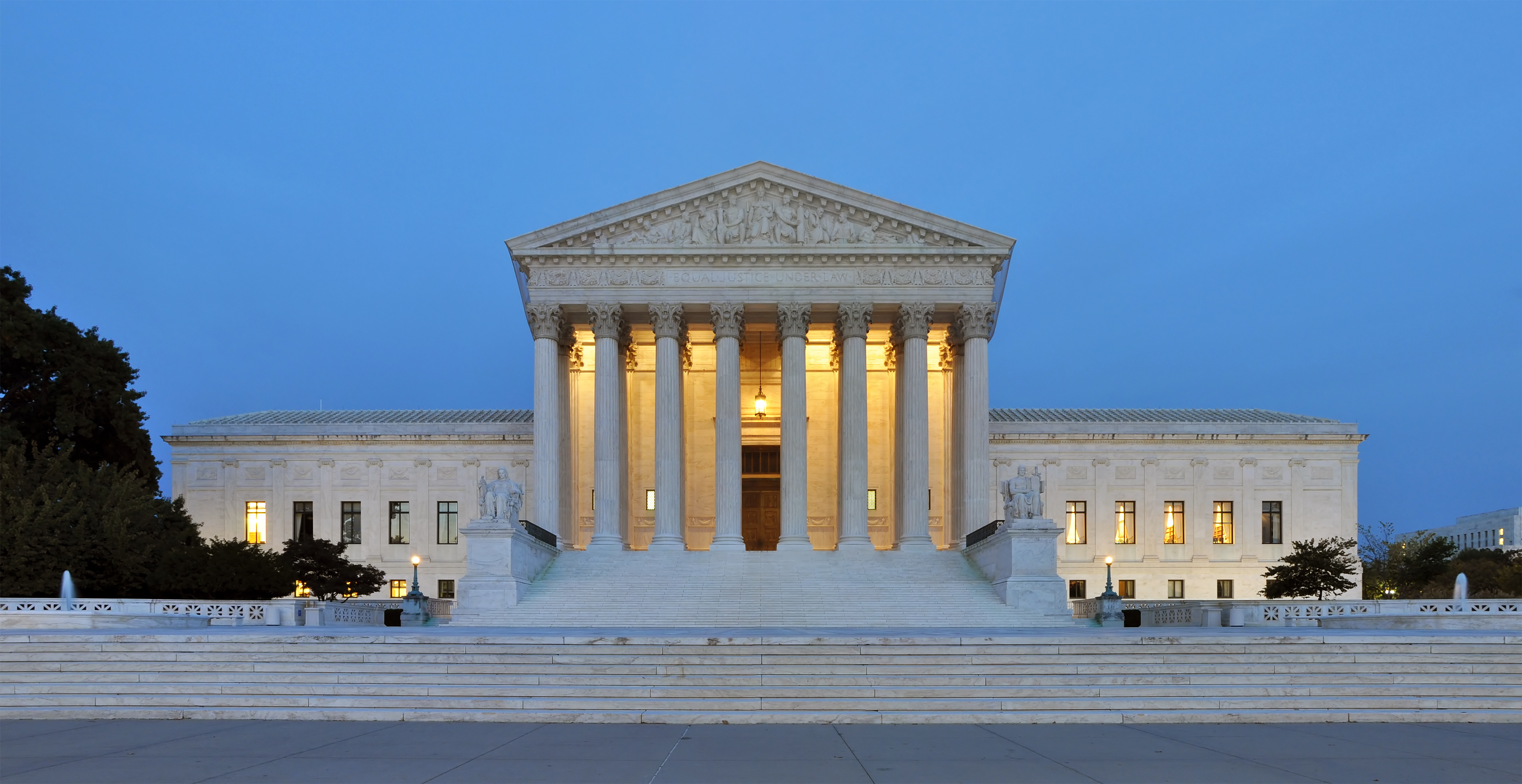 U.S. Supreme Court facade at dusk, lit