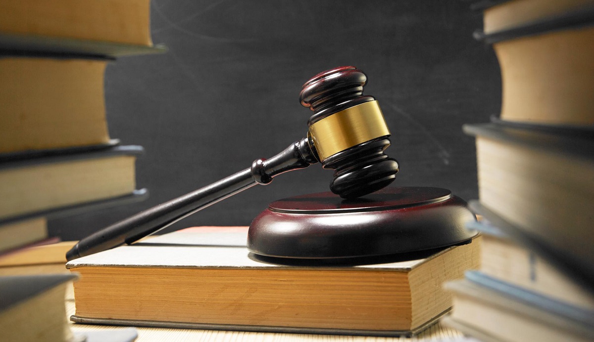 A gavel resting on law books